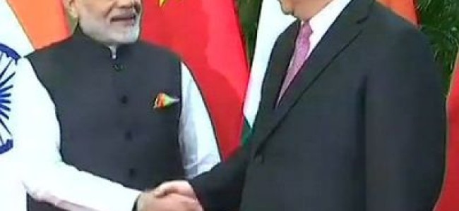 Modi in China: PM invites Xi to informal summit in India next year