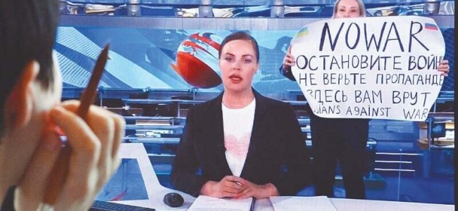 Anti-war activist interrupts live Russian TV show