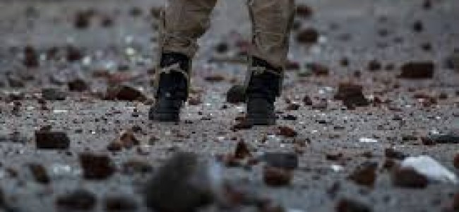 Youth Pelt stones as forces cordon village