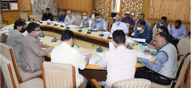 Div Com reviews progress on Transit Room Tenements other migrant issues